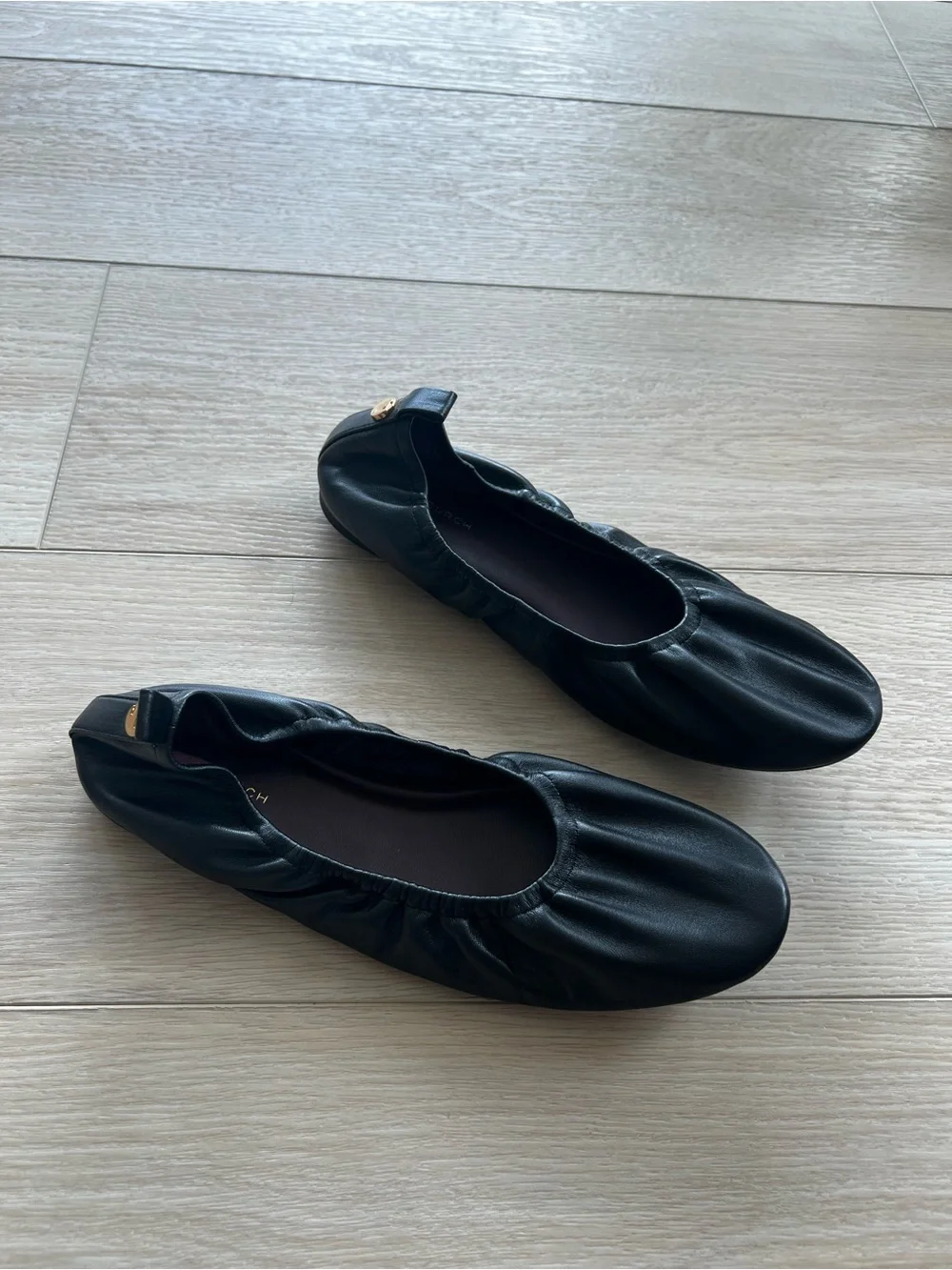 Tory Burch “Eddie” Black Ballet Flats with Gold Logo Button
